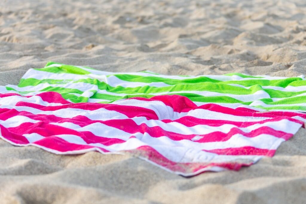 Striped Beach Towels on Sand